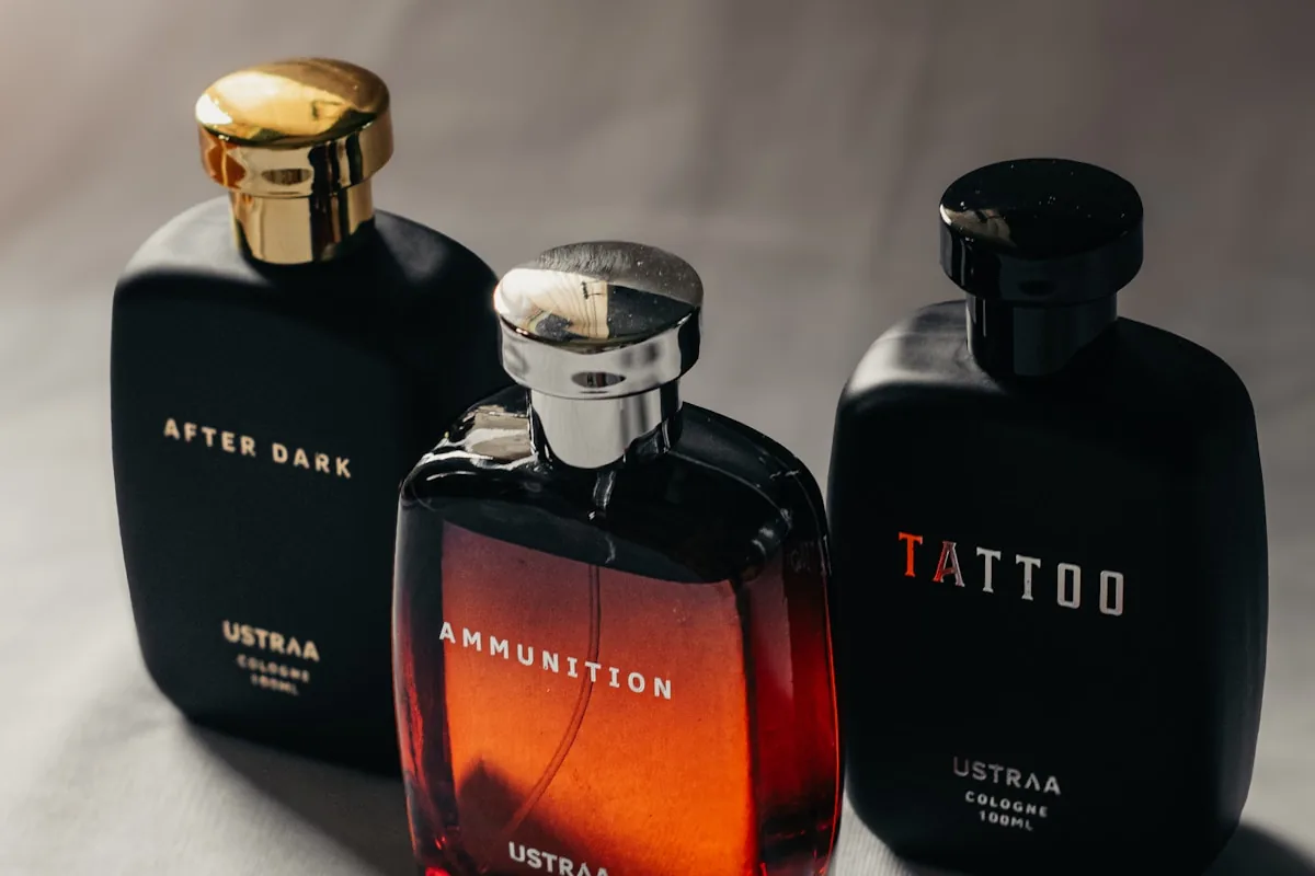 Three perfume bottles lined up on a clean light surface — starter collection