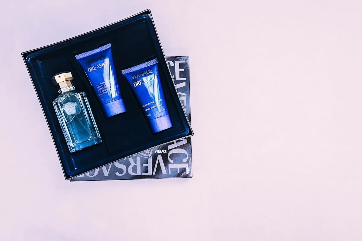 Versace cologne bottle with its box on a flat lay — men's gift guide mood